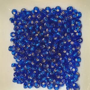 Bunadperler 67300 10/0 metallkjerne Fana blå, mørk kongeblå